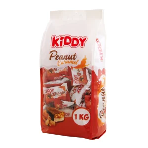 PIENINIU ŠOKOLADU GLAISTYTI KARAMELĖS SKONIO SALDAINIAI SU ŽEMĖS RIEŠUTAIS KIDDY PEANUT CARAMEL, 1 KG